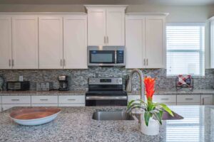 Champions Gate Magical Retreat Kitchen granite countertops and stainless steel appliances