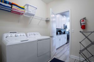 Champions Gate Magical Retreat laundry room with washer and dryer