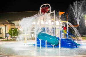 Champions Gate Oasis kids splash pad pool at night