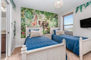 Champions Gate Epic Villa Safari themed kids room upstairs with two twin beds