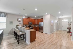 Champions Gate Rolling Skies kitchen facing foyer to front of home