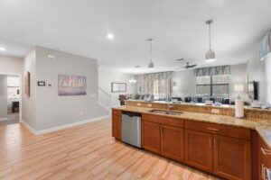 Champions Gate Rolling Skies kitchen with upscale granite countertops and stainless steel appliances