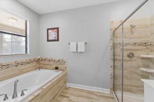 Champions Gate Rolling Skies Garden Tub in downstairs primary ensuite bathroom