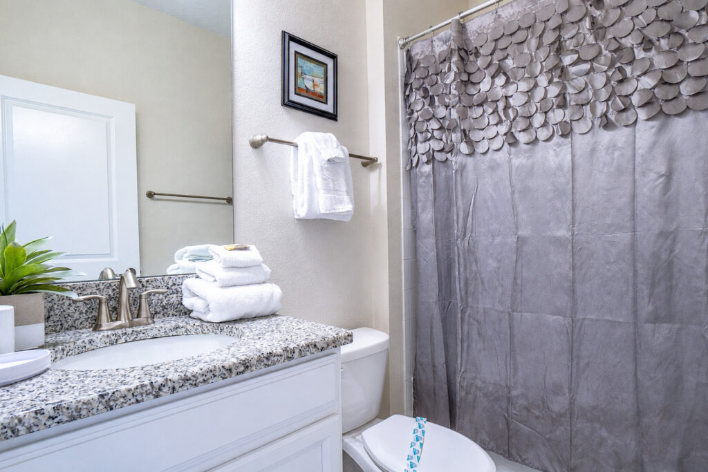 Champions Gate Magical Retreat full guest bathroom connected to foyer and downstairs bedroom