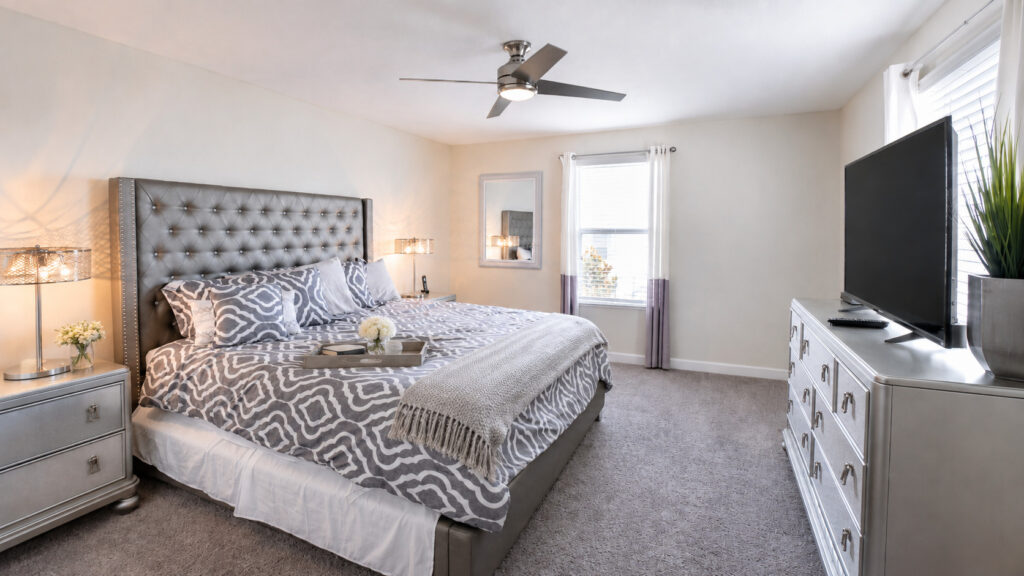 Champions Gate Magical Retreat upstairs primary ensuite bedroom with TV